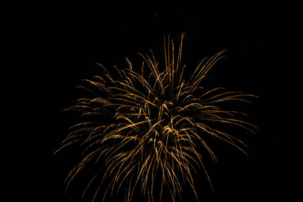 istock Low angle shot of bright fireworks at night - great for wallpapers and backgrounds 1441179582