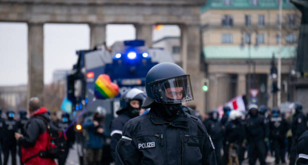 demonstration in berlin with the police - water cannon imagens e fotografias de stock