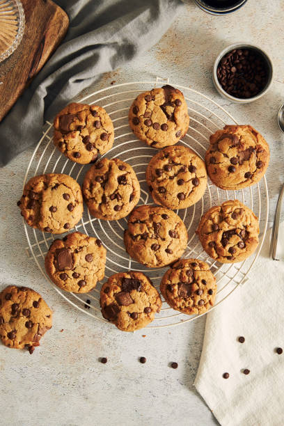 istock Vertical top view of deliciously baked cookies with chocolate chips on a baking grid 1441179891