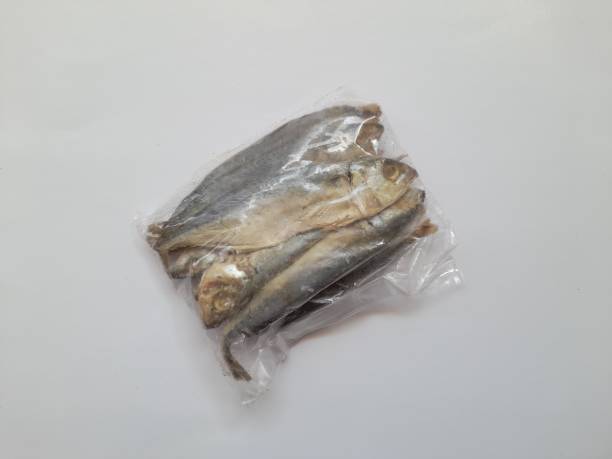 istock Raw peda salted fish meal in plastic top view on white background. 1441180358