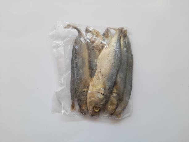 istock Raw peda salted fish meal in plastic top view on white background. 1441180392