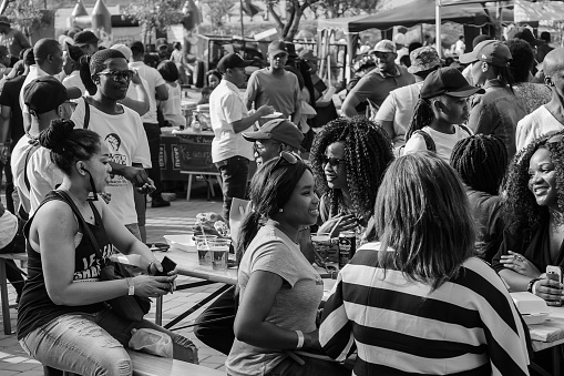 Johannesburg, South Africa – March 13, 2021: Soweto, South Africa - September 17, 2017: Diverse African people at a bread based street food outdoor festival