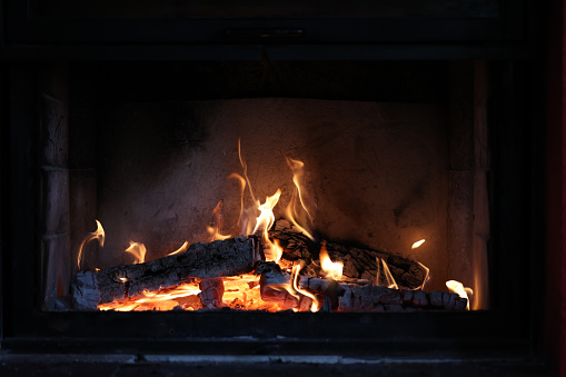 A nice fireplace with burning firewood
