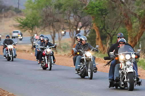 Johannesburg, South Africa – April 24, 2019: old motorcycles riding together with passengers on the tarmac