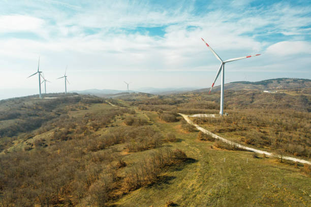 istock electricity generation from windmills in forest area, renewable energy drone view 1441182045