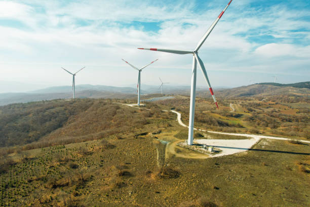 istock electricity generation from windmills in forest area, renewable energy drone view 1441182209
