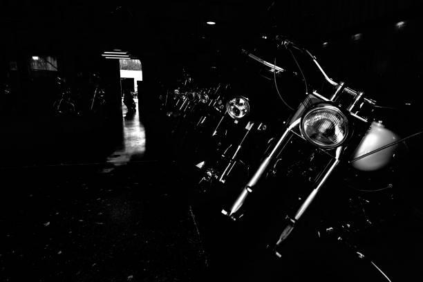 istock Dark image of old style motorcycles lined up 1441183401