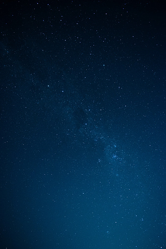 A beautiful vertical shot of a starry night sky