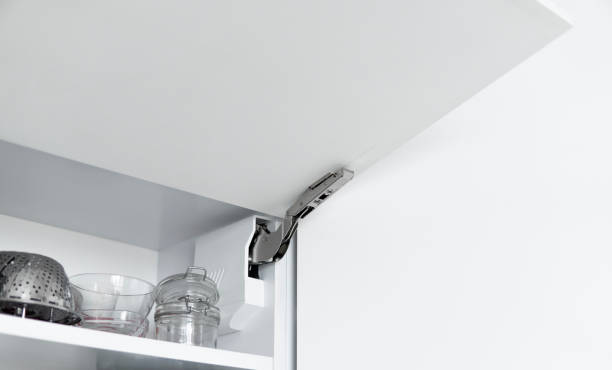 istock Kitchen cabinet with open fronts. Lift system for bifold fronts for direct access in kitchen cabinets.Innovative lifting mechanism for kitchen doors. Kitchen design. 1441184429