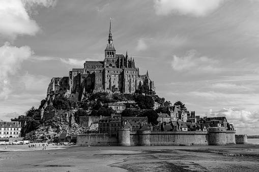 A grayscale shot of the Mont Saint-Michel castle in France