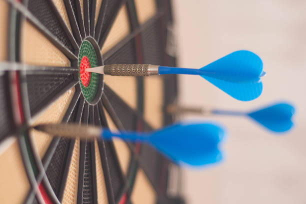 istock Selective focus shot of a dartboard with arrows 1441185071
