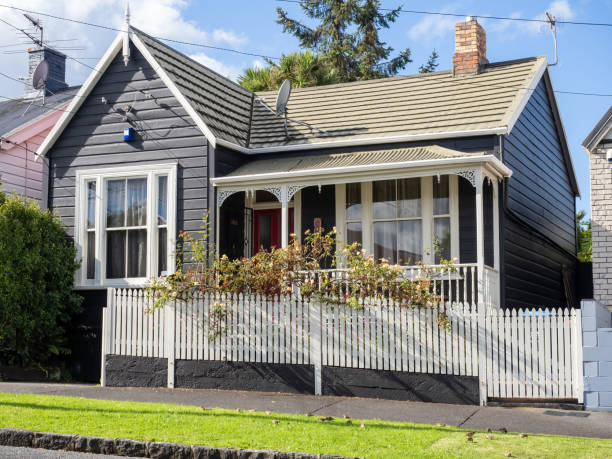 Auckland, New Zealand – April 27, 2021: Residential bungalow house in Ponsonby with cross gabled roof.