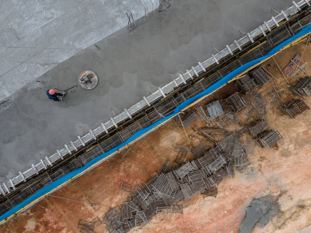 istock Aerial view of workers working on the construction site 1441186548