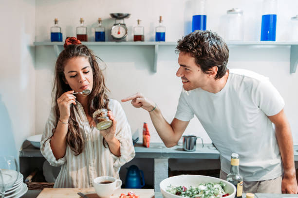 istock Girlfriend got caught eating desert by her boyfriend. 1441186714