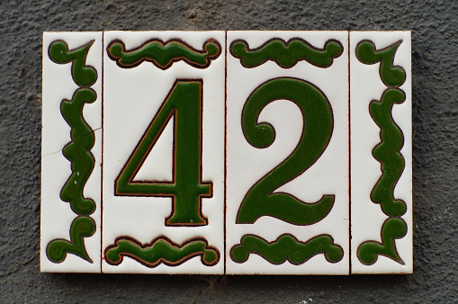 Beautifully tiled house number. For sci-fi fans and insiders, it is the Answer to the Ultimate Question of Life, the Universe, and Everything. 42