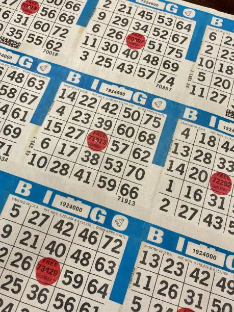 A vertical shot of bingo cards with the different numerical arrangement