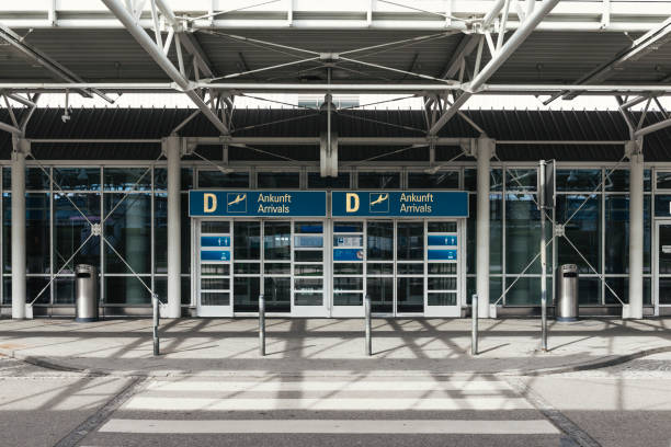 Closed entrance door to the abandoned arrivals area at Terminal 1 at Munich Airport, Bavaria, Germany Closed entrance door to the abandoned arrivals area at Terminal 1 at Munich Airport, Bavaria, Germany munich airport stock pictures, royalty-free photos & images