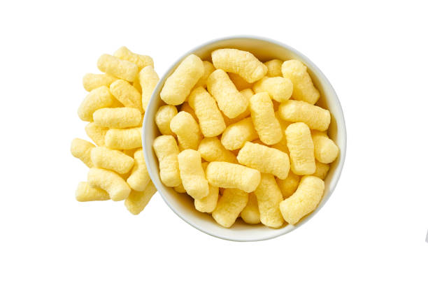 istock crispy corn sticks spill out of the bowl isolated on white background. Top view 1441188997