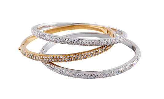 Three bracelets with small diamonds isolated on a white background