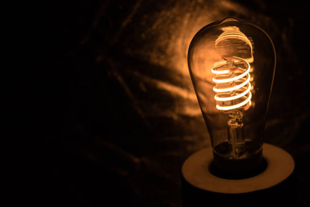 istock Scary, mysterious cave-like room with a single lightbulb illuminating the darkness 1441190765