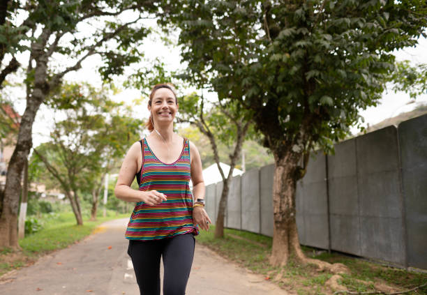 istock Woman exercising in a park 1441191303