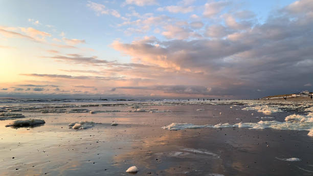 istock Drift ice on the beach under the cloudy sky during sunset 1441191484