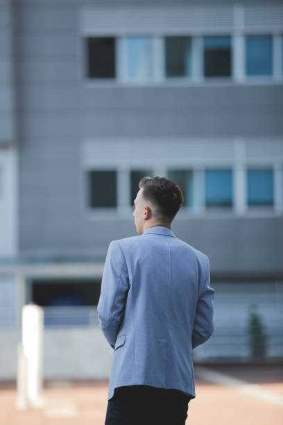 istock Young elegant Caucasian man wearing an expensive blue suit at an event 1441191721