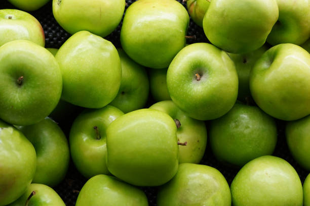 istock Horizontal background of green fresh ripe apples 1441192204