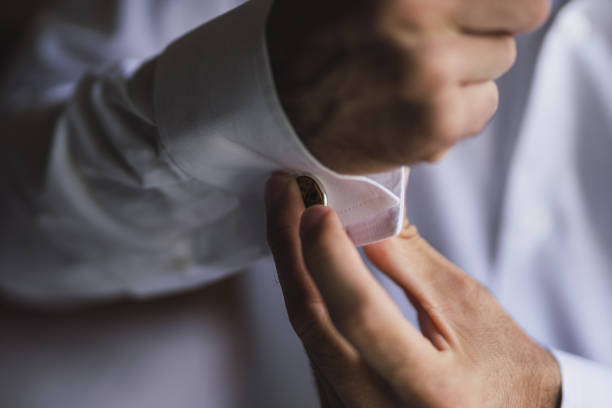 istock Groom buttoning cuffs of the shirt 1441193062