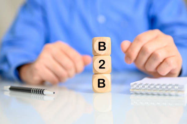 istock Businessman with dices reading B2B in front of him 1441193492