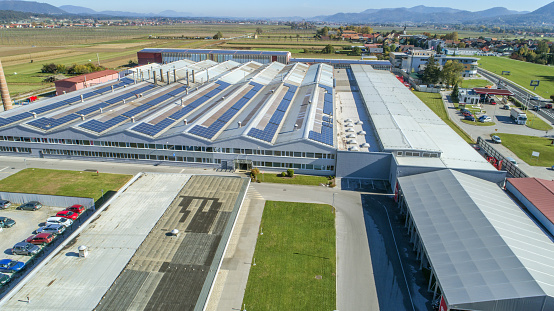 Sempeter v Savinjski dolini, Slovenia – June 15, 2018: Aerial of huge agricultural cooperative with solar panels on roof