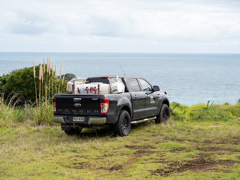Auckland, New Zealand – April 15, 2021: View of black Ford Ranger pickup truck at Waitakere Regional Park
