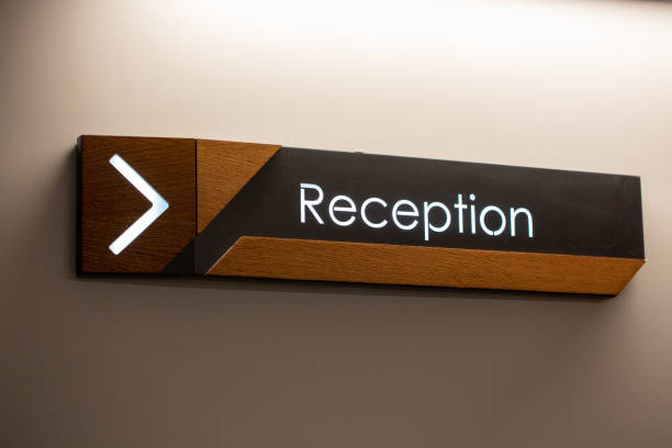 istock Reception sign with direction arrow on the wall 1441195206