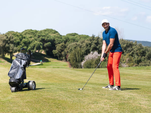 istock Young Caucasian male playing golf on a professional golf course 1441196348