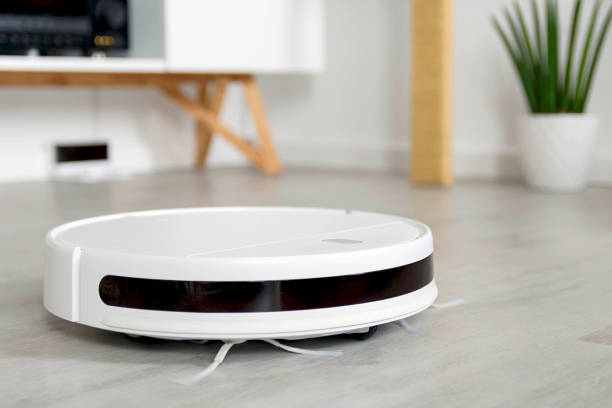 istock Round wireless vacuum cleaner on the floor 1441196852