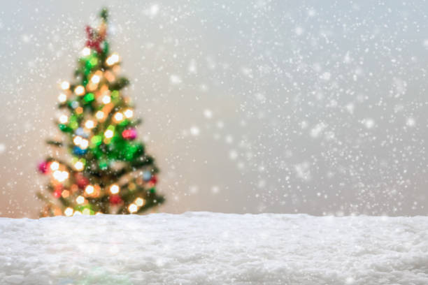 istock Empty white snow with blur Christmas tree with bokeh light background 1441197076