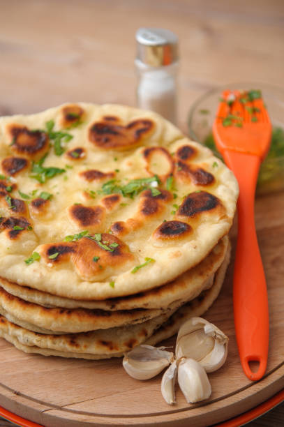 istock Vertical shot of naan bread with garlic 1441197105