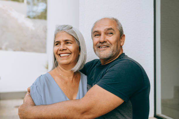 istock Smiling senior couple hugging 1441197842