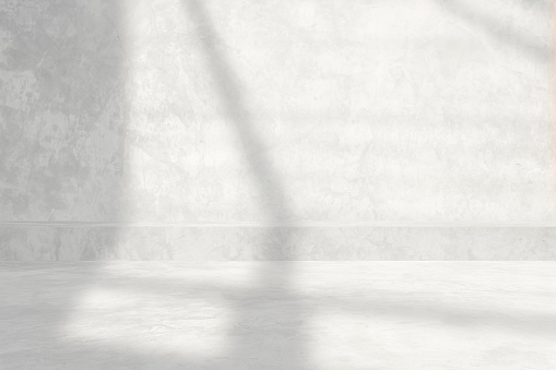 White Raw Concrete Room with Light Beam and Shadow from the Window Background.