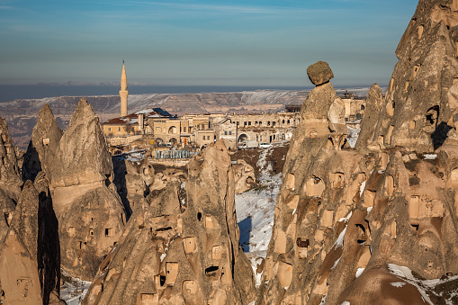 Panoramic view of Ortahisar castle with mosque and old town at Cappadocia, Turkey.