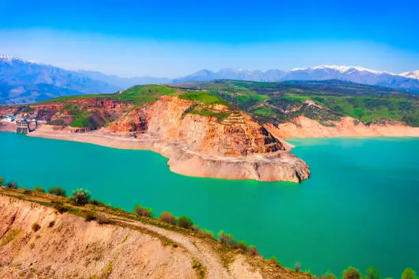 Lake Charvak or Chorvoq is a water reservoir in Chimgan region, Tian Shan or Tengri Tagh mountain range near Taskent city in Uzbekistan