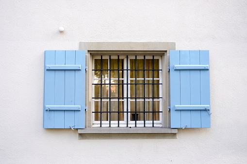 Vintage Wooden Window on Stucco Wall Background in Minimal Style.