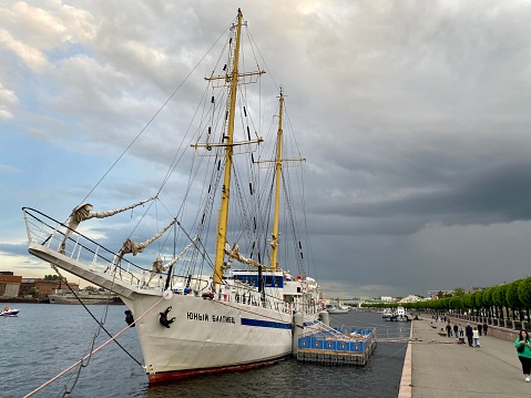 Saint Petersburg, Russia - June 03, 2022: Training Sailboat docked on Neva River