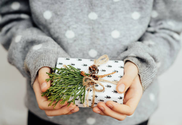 istock A child holds a box gift in his hands 1441210005