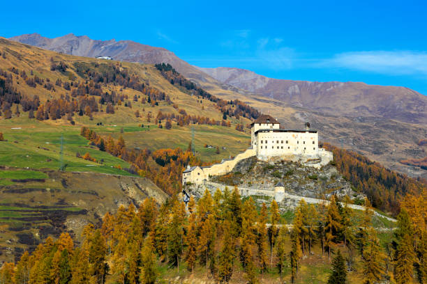 high view of the tarasp castle in autumn splendid color - castle engadine alps lake water imagens e fotografias de stock