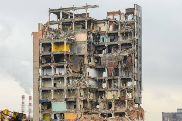 istock Building demolition and crashing by machinery for new construction 1441214142