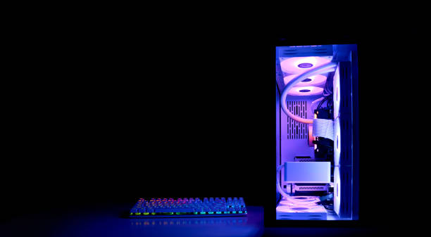 istock Gaming PC with rainbow LED light. Modern liquid cooled gaming computer. Powerful PC in a glass case, front view. 1441217805
