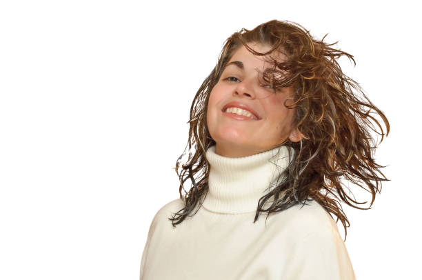 Happy young woman is looking at something that pleases her a lot.