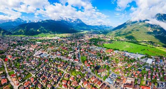 Garmisch-partenkirchen and Zugspitze mountain aerial panoramic view. Garmisch Partenkirchen is an Alpine ski town in Bavaria, southern Germany.