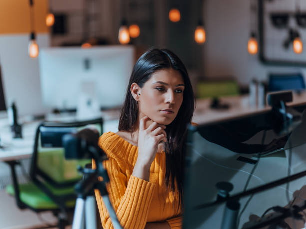 istock A young woman using a camera to present her business with online clients 1441222476